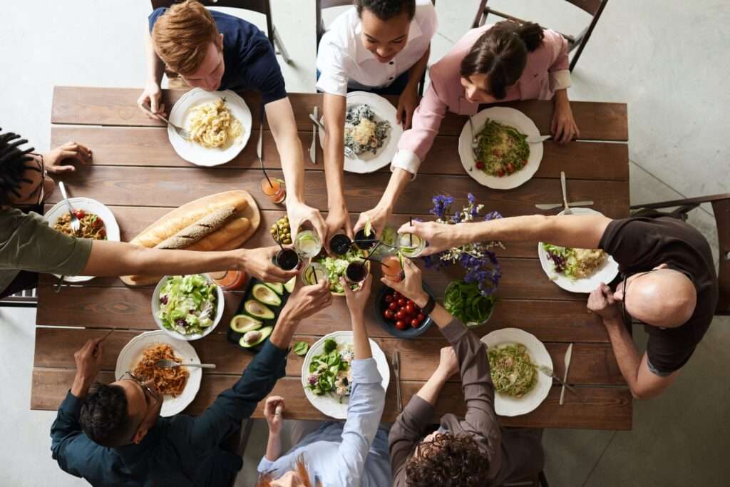 people drinking wine and eating